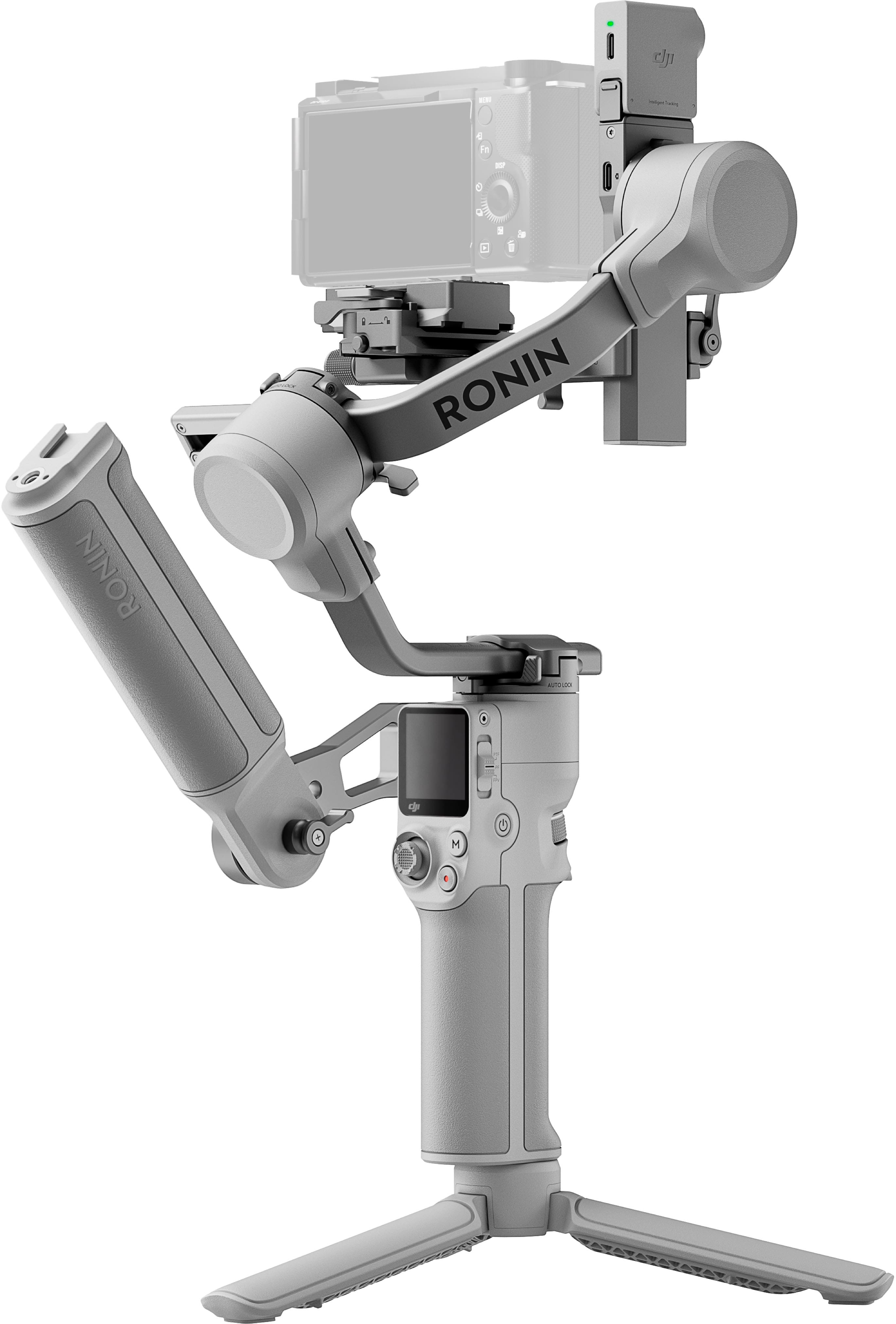 DJI RS 4 Mini gimbal being unboxed on a wooden table with accessories laid out